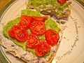 Open faced tuna sandwich with cherry tomato and guacamole spread.jpg