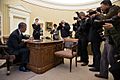 Photojournalists photograph President Barack Obama