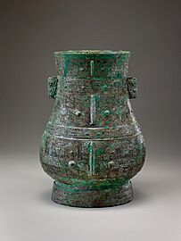Ritual wine container (hu) with masks (taotie) and dragons