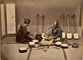 Shamisen crafter with a customer