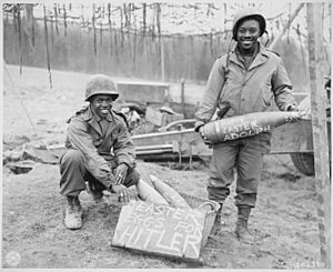 "Easter morning, T-5 William E. Thomas...and Pfc. Joseph Jackson...will roll specially prepared eggs on Hitler's lawn.", - NARA - 531253
