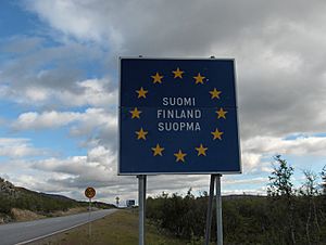 Finnish border sign on the E8 road at Kilpisjärvi (in Finnish, Swedish and Northern Sami)