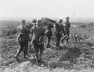 German prisoners carrying wounded NZ soldier, 27 August 1918