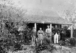 Rosenblatt family posing outside a wooden dwelling, Ropeley, Queenslandf