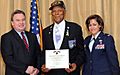 Tuskegee Airman Tech. Sgt. (Ret.) George Watson Sr. is presented the Purple Heart medal by Congressman Christopher Smith and Col. Gina M. Grosso, Joint Base McGuire-Dix-Lakehurst commander