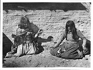 Two Mojave Indian woman playing a game (fortune-telling with bones?), ca.1900 (CHS-3410)