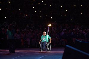 201000 - Opening Ceremony paralympian Kevin Coombs torch - 3b - 2000 Sydney opening ceremony photo.jpg
