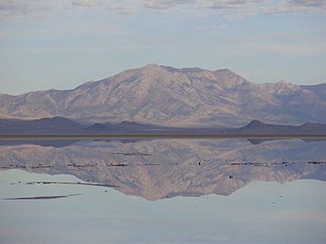 2015-09-29 08 37 08 View of Pilot Peak, Nevada from milepost 18 on Interstate 80 in the Bonneville Salt Flats of Tooele County, Utah, with still waters over the salt flats reflecting the clouds and mountains.JPG