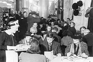 Customers enjoying afternoon tea at Lyon's Corner House on Coventry Street, London, 1942. D6573