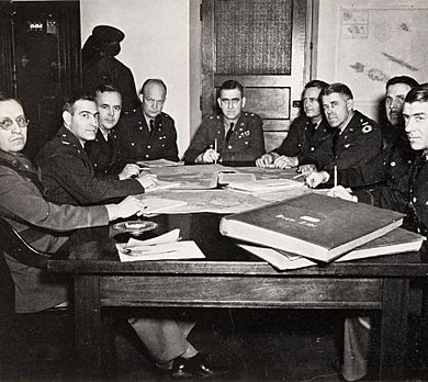 Harrison Jr., Lee Gerow, Crawford, Eisenhower, Leonard Gerow, Handy, Sherrill, McKee, MacKelvie at the meeting of War Plans Division