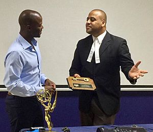 Kendis Gibson (left) in 2017 receiving the keys to Belize City from Mayor Darrell Bradley