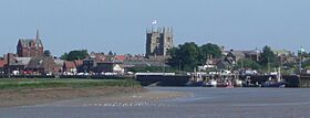 King's Lynn, known for both King's Lynn Minster and a statue to George Vancouver. The town is the administrative centre and largest settlement in the borough.