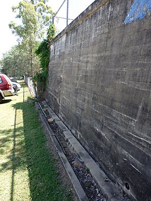 Lower playground eastern retaining wall, southern end, with gutter, looking SW (EHP, 2015)