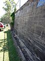 Lower playground eastern retaining wall, southern end, with gutter, looking SW (EHP, 2015)