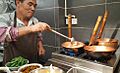 Mixian Rice Noodles Being Prepared in Copper Pots