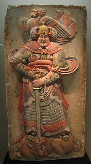 Painted stone relief of a warrior