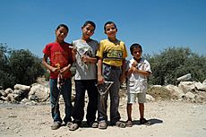 Palestinian children with slingslots