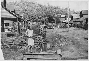 Pumping water in Wilder, Fentress County TN 1942