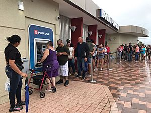 Residents of Ponce, Puerto Rico, line up at an ATM in hopes of getting some cash. More than a week after Hurricane Maria struck, residents are waiting in long lines to withdraw money and for gasoline
