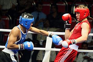Sh.Balwinder Beniwal (Left) of India ,punching a stroke to Mr. Ross Jesse of Australia in the Semi final match of 69kg Welter round of Boxing event at the 3rd Commonwealth Youth Games-2008, in Pune on October 16, 2008.jpg