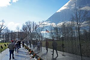 US flag reflexion on Vietnam Veterans Memorial 12 2011 000124