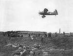 A Westland Lysander of No. 13 Squadron RAF based at Hooton Park, Cheshire, provides aiming practice for members of the Home Guard, at the Western Command Weapons Training School at Altcar, near Formby, 17 Septe H4209