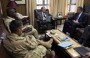 Brigadier General Lloyd Austin converse with Secretary of Defense Donald Rumsfeld