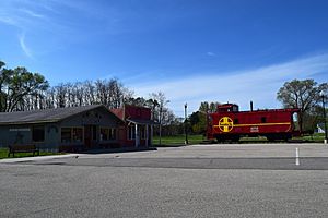 Avoca Mercantile and an Atchison, Topeka and Santa Fe Railway caboose in Avoca