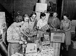 StateLibQld 2 105888 Red Cross workers packing Christmas presents for the Fighting Forces during World War II, October 1942