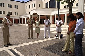 US Navy 050714-N-9580K-001 Navy Chaplain Dave McBeth, left, leads an informal gathering of personnel aboard Naval Support Activity (NSA) Naples during a Europe-wide coordinated two-minute moment of silence