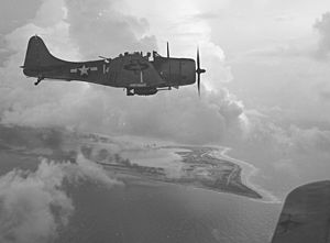 A Douglas SBD Dive Bomber over Wake Island, 1943