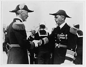 Admiral William D. Leahy (right) shakes hands with Admiral Joseph M. Reeves NH 47298