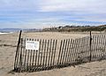 Fencing and signage at Dockweiler State Beach. (34405027181).jpg