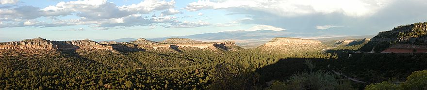 Panorama taken from the Anderson Overlook with mesas, canyons, and pine trees