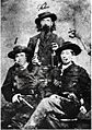 Arch Clements, Dave Pool, and Bill Hendricks brandishing revolvers
