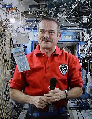 Chris Hadfield unveiling $5 banknote of the Frontier Series from ISS during Expedition 35, 30 April 2013