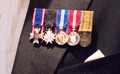 Miniature medals with black tie