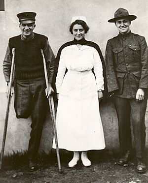 Navy Nurse Hazel Herringshaw stands with two of her patients -- 1918