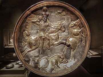 Plate depicting a boar hunt Persia (Iran) Sasanian Period 4th century CE Silver and Gilt (19527593672)