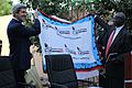 Senator John Kerry receives SSRC banner at southern Sudan referendum event