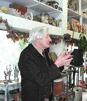 Belgian sculptor Olivier Strebelle talks with a group of American writers in his home/studio outside Brussels in January 2009.