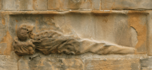 Detail showing body in a burial shroud, grave of William Carstares, Greyfriars, Edinburgh (1720)