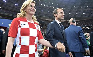 Kolinda Grabar-Kitarović and Emmanuel Macron prepare to award the first and second places in the final of the 2018 Russian Football Cup