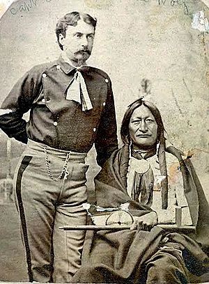 Lt. Willam Philo Clark stands next to Little Hawk at the Red Cloud Agency in 1877