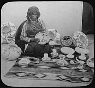 Nampeyo, Hopi pottery maker, seated, with examples of her work, 1900 - NARA - 520084