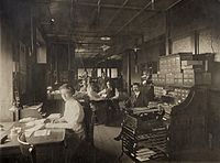 Women and Men Working in Office at Standard Adding Machine Company, 3701 Forest Park Boulevard