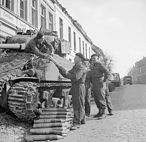 British Sherman tank crew load ammunition Xanten 21-03-1945 IWM BU 1966