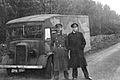 Photograph of Cholmondeley and Montagu in uniform, standing in front of a lorry