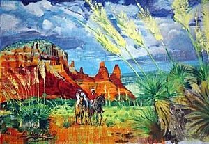Original Navajo horse riders near sandstone cliffs