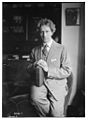 Percy Grainger holding a book in 1919